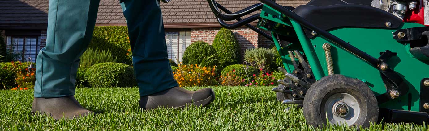 TruGreen specialist aerating lawn