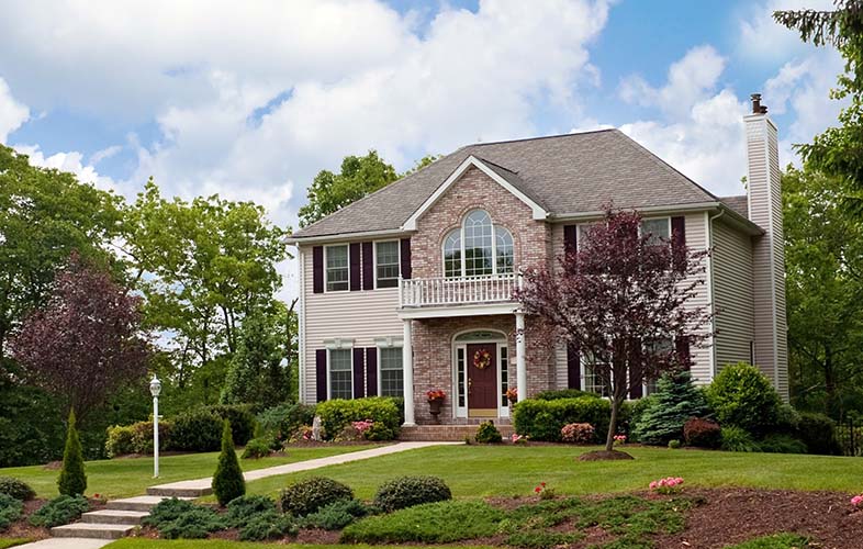 Home with lawn and trees