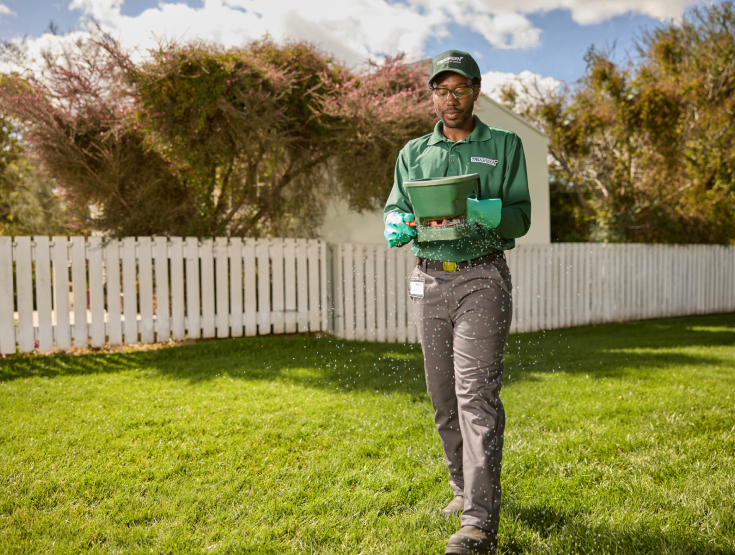 TruGreen specialist assessing a lawn