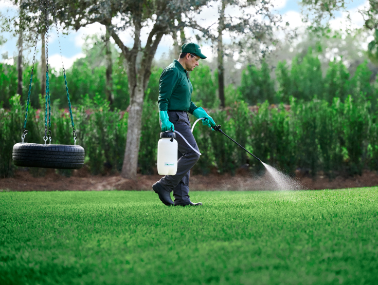 TruGreen specialist treating a lawn